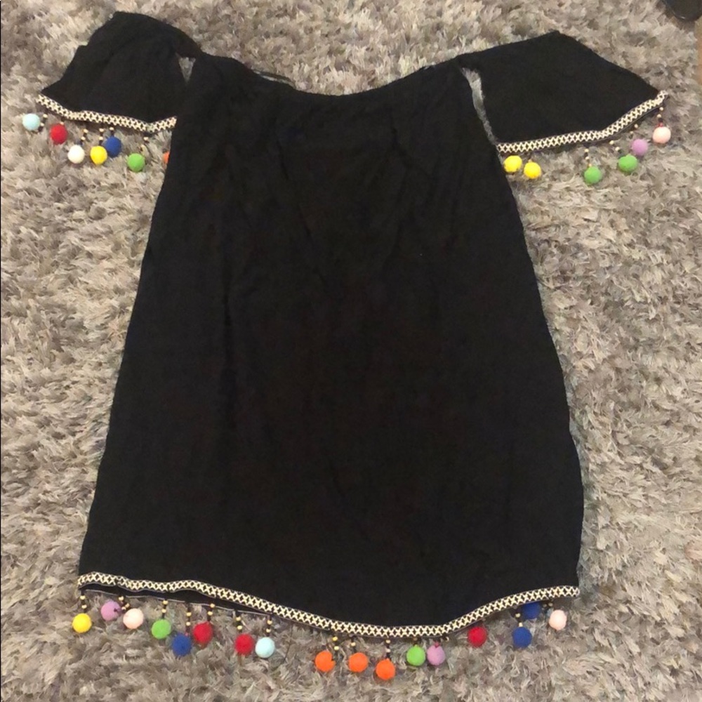 Festive black pompon dress